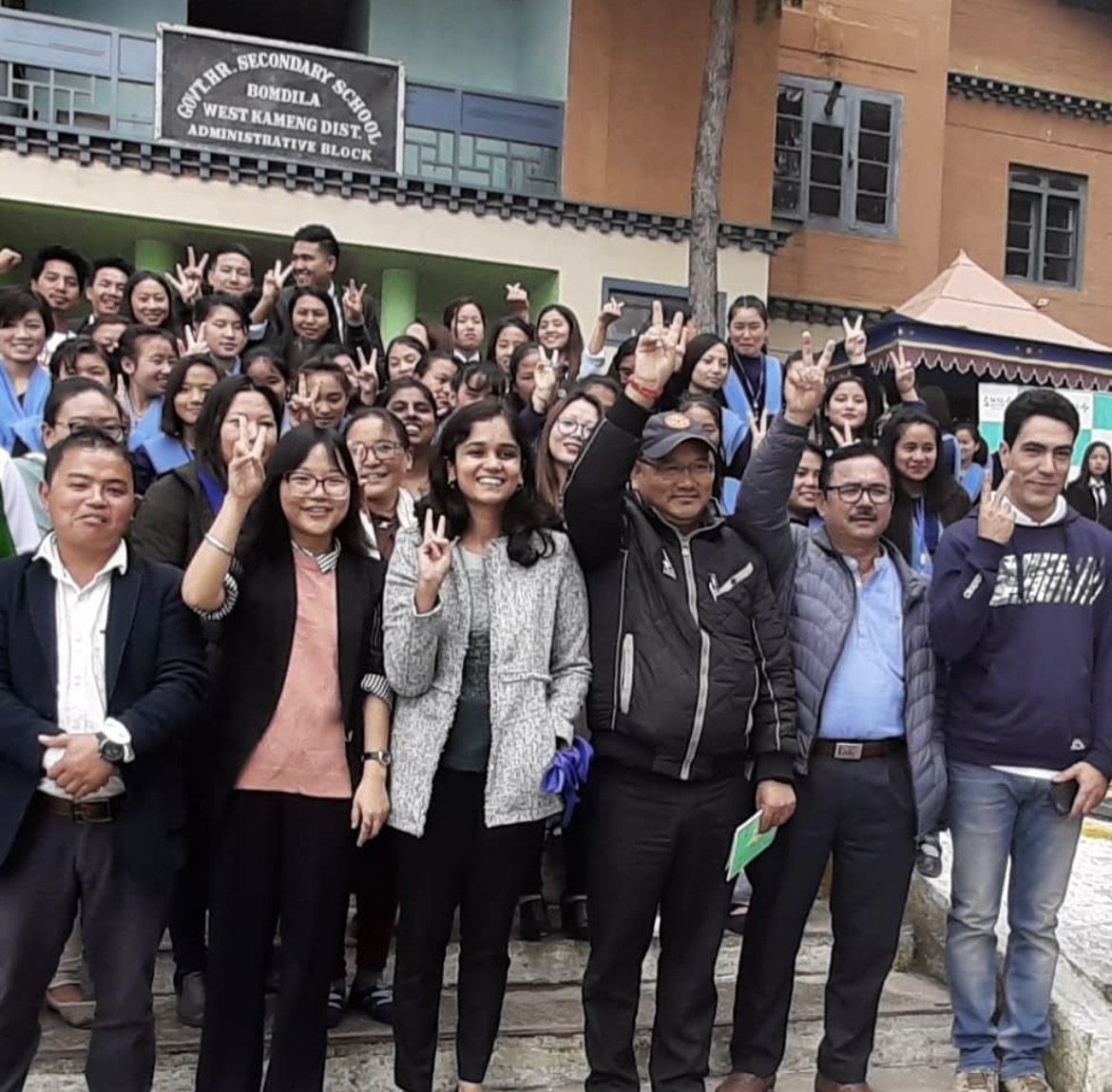 Dr Aditi Chaturvedi with students and staff outside a government secondary school in Bomdila, Arunachal Pradesh, after a breast cancer awareness talk